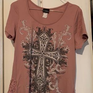 Day trip pink top with a cross on it.